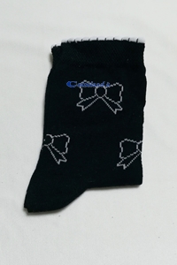 Black sock with white bows